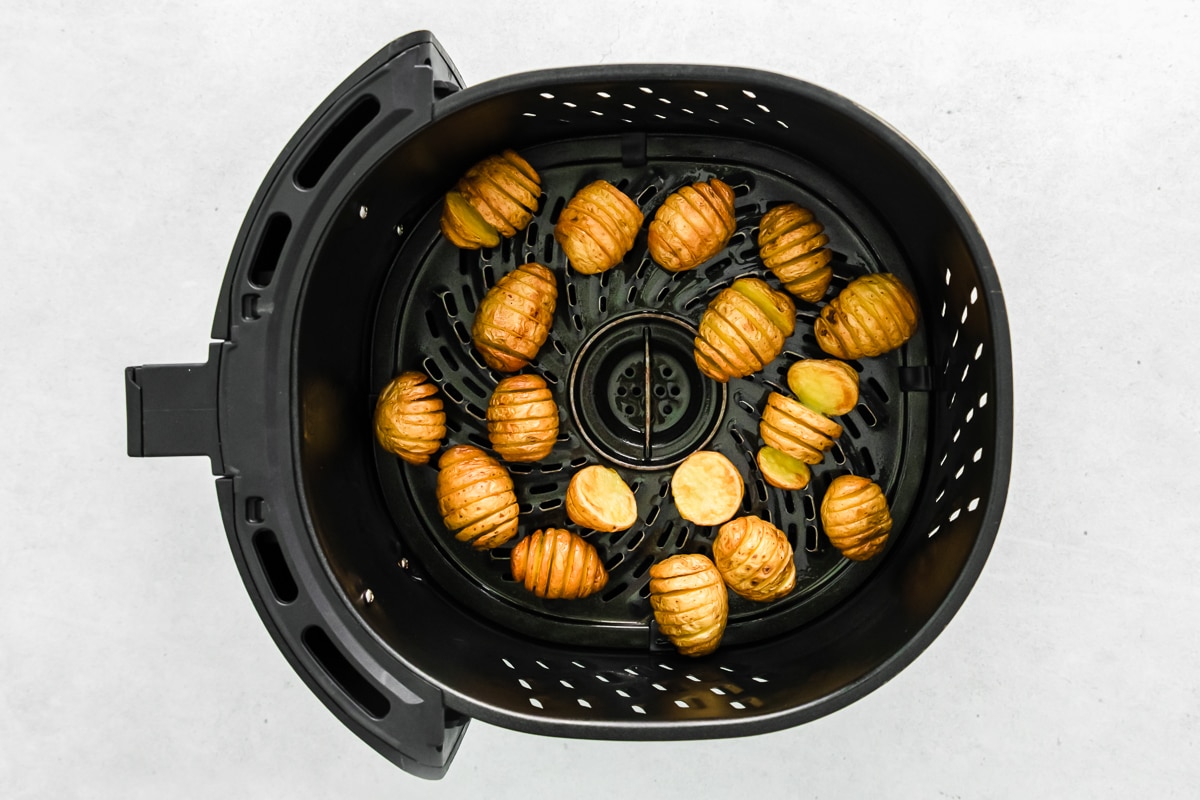 small potatoes in air fryer baket.