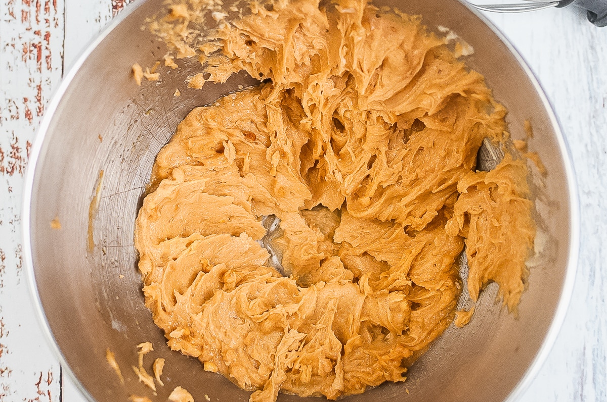 peanut butter cookie dough in a stainless steel bowl.