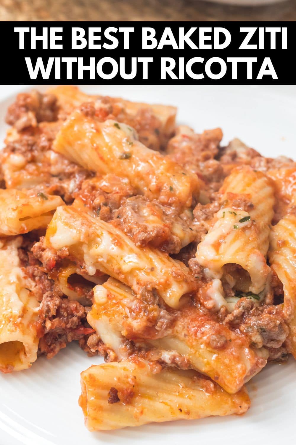 a plate of baked ziti and text on image saying homemade baked ziti without ricotta.