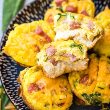 breakfast muffins cut open on a plate