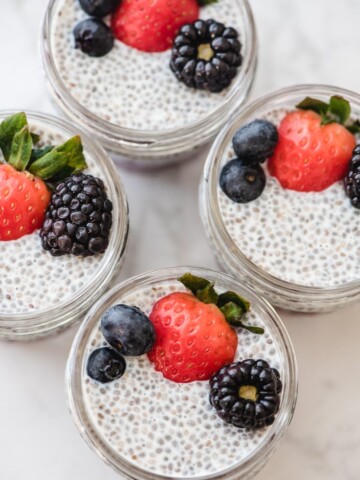 chia seed pudding with berries in meal prep jars