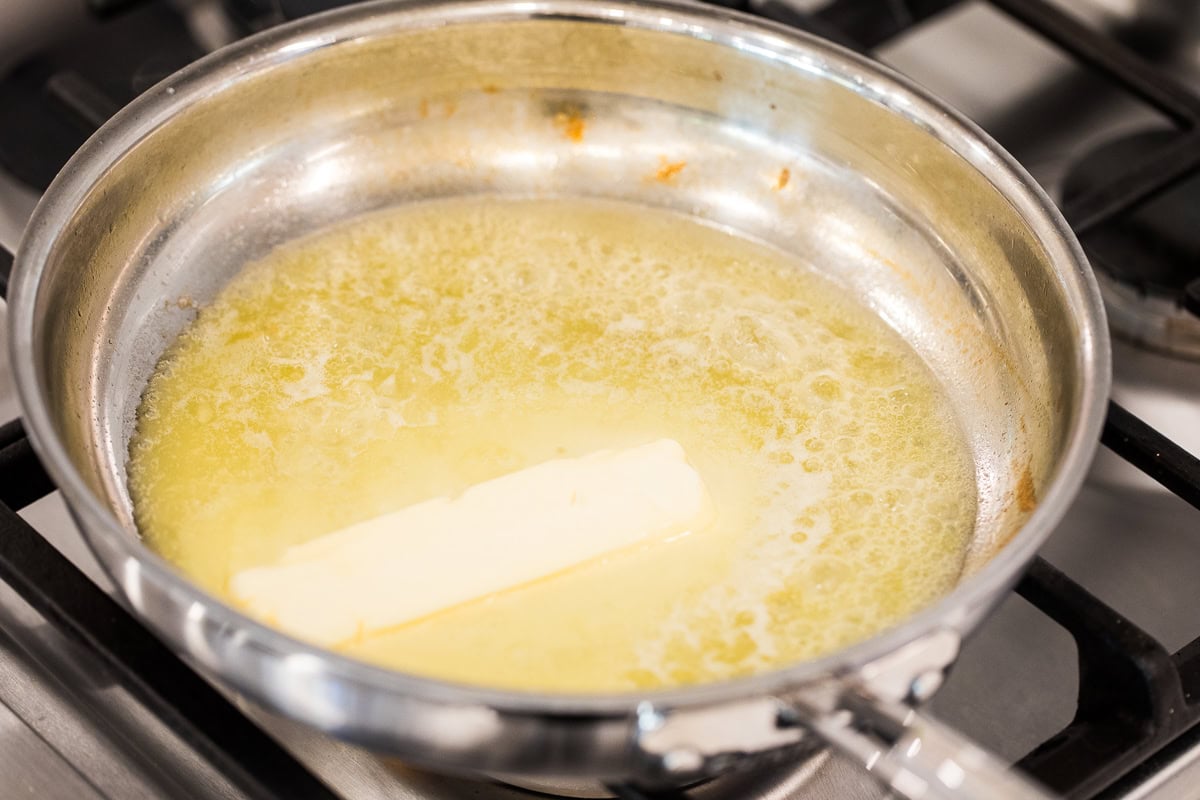 melting butter in skillet on the stove.