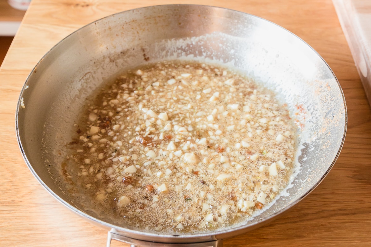 garlic in butter and oil and pan drippings simmering.