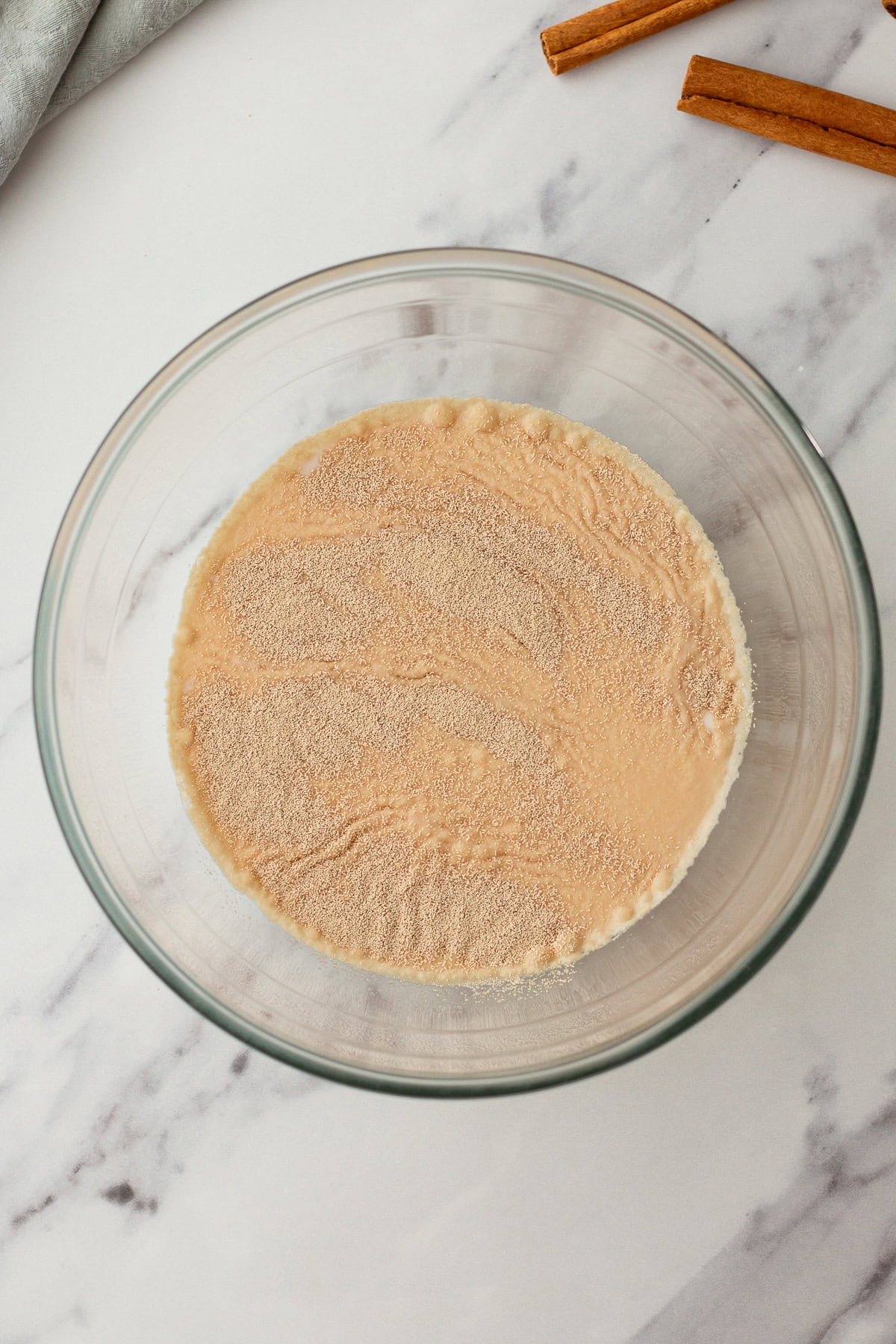 bowl of activating yeast in warm milk.