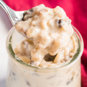 condensed cream of mushroom soup in a glass jar with spoon scooping it out.