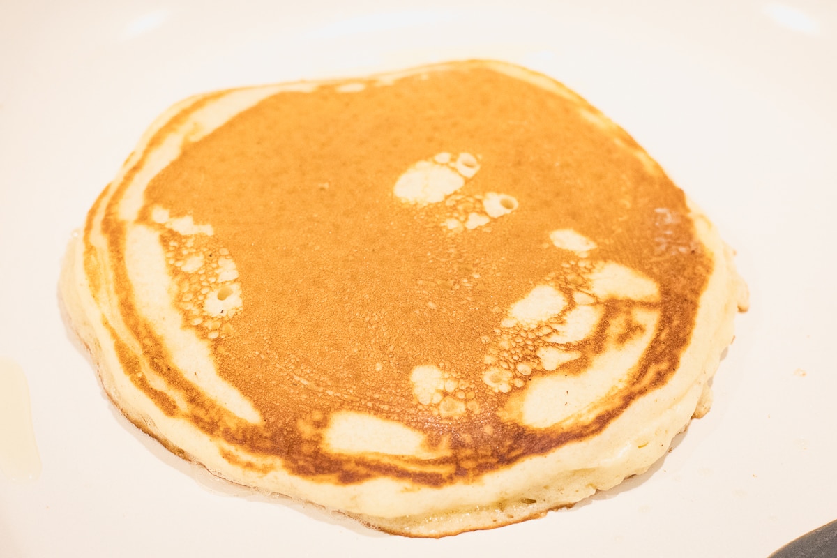 flipped pancake in a pan.