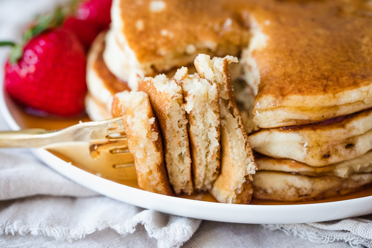 close up of fork bite of dairy free pancakes.