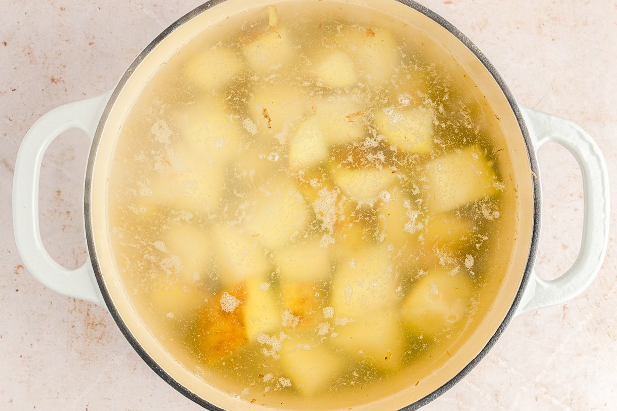 potatoes in a boiling water in a dutch oven.