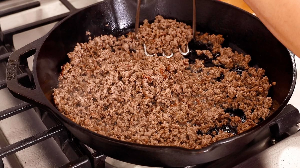 ground beef in cast iron skillet.