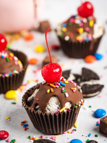 ice cream cupcakes with cherries on top