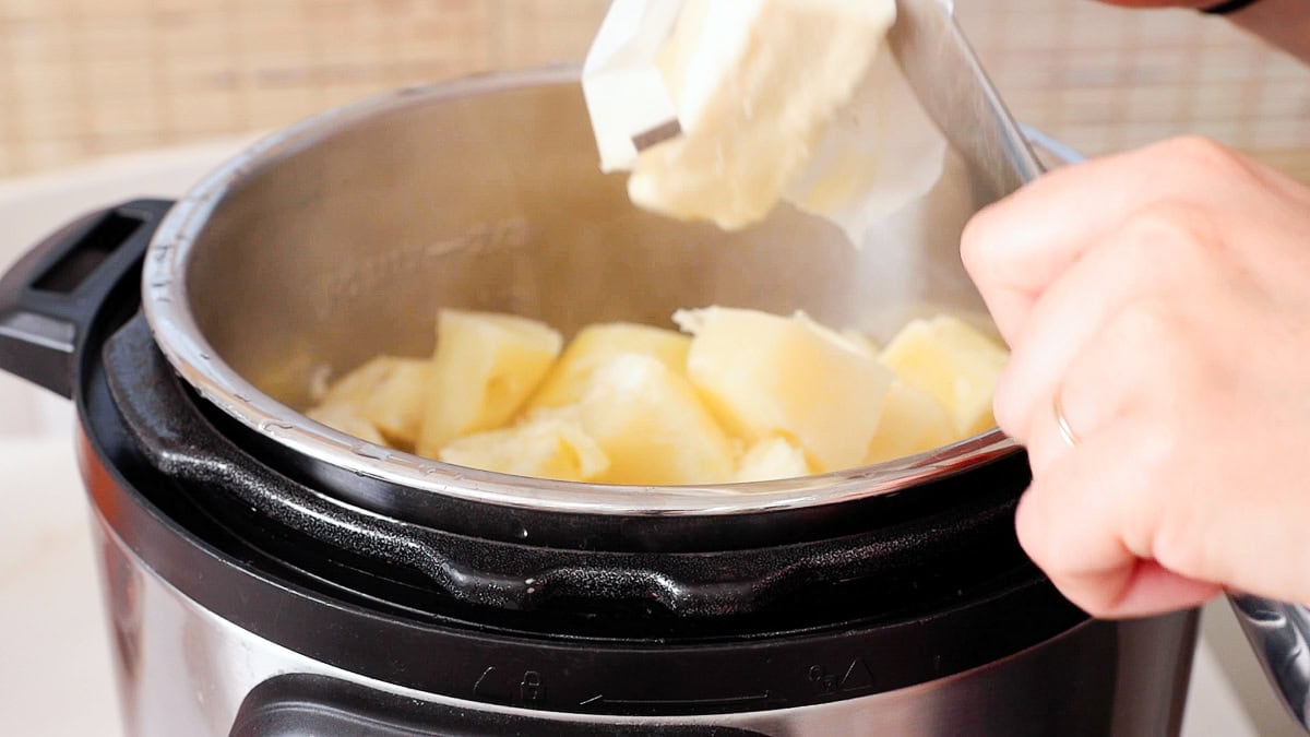 adding softened butter to the instant pot.