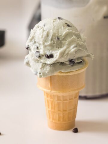 mint chocolate chip ice cream in a cone made in the ninja creami deluxe.