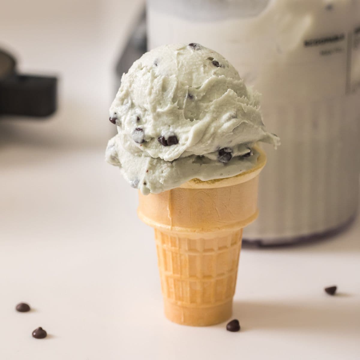 mint chocolate chip ice cream in a cone made in the ninja creami deluxe.