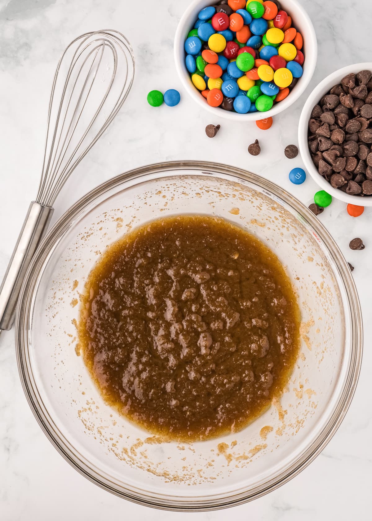 sugar and butter mixed in a glass bowl.