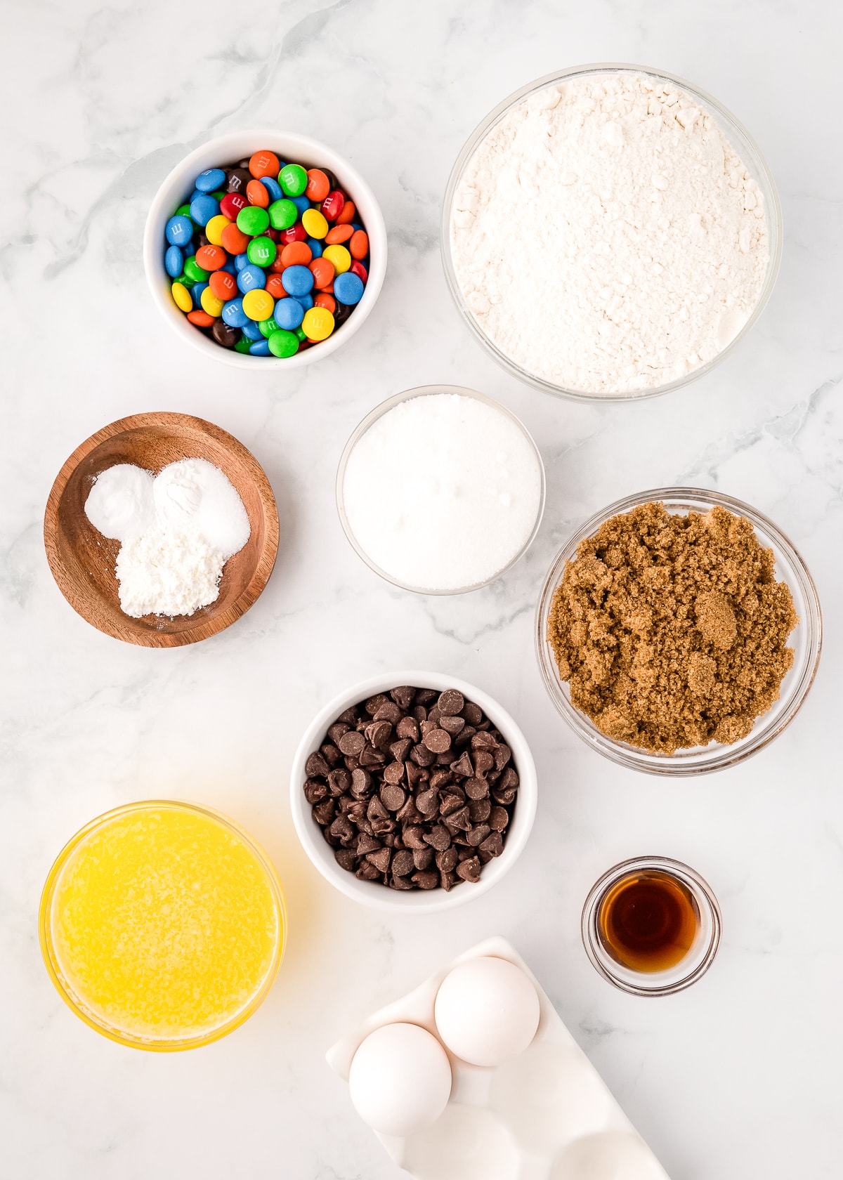 ingredients in bowls for m&m cookie bars.