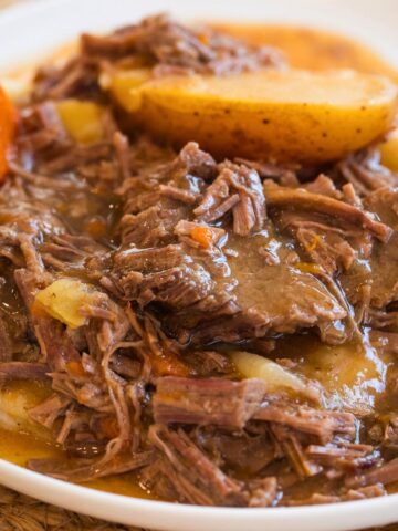 slow cooker top round roast on a white plate.