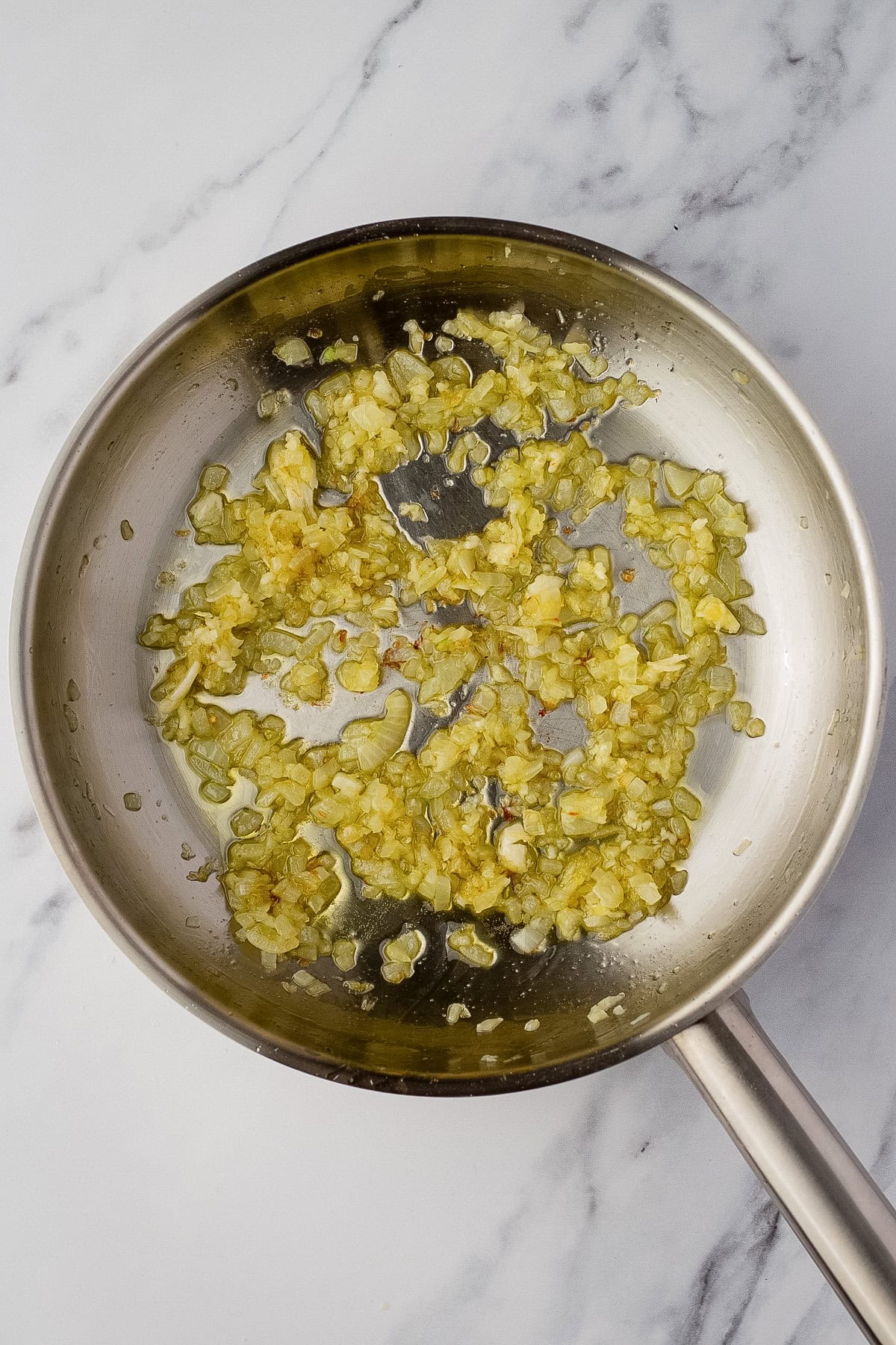 sauteed onions and garlic in a pan with oil.