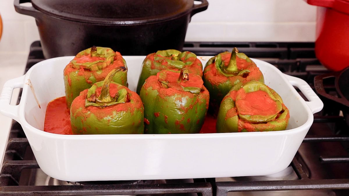 stuffed peppers in a casserole ready to bake.