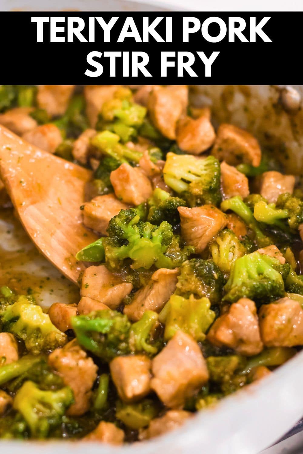 teriyaki pork stir fry with broccoli in a pan with a wooden spatula with text on image for pinterest.