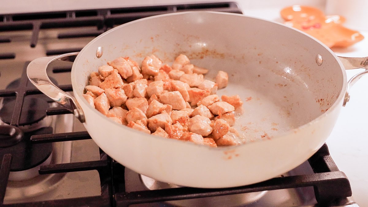 browned pork in a pan.