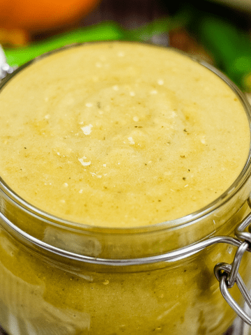 green enchilada sauce in a medium sized hinged top glass jar.