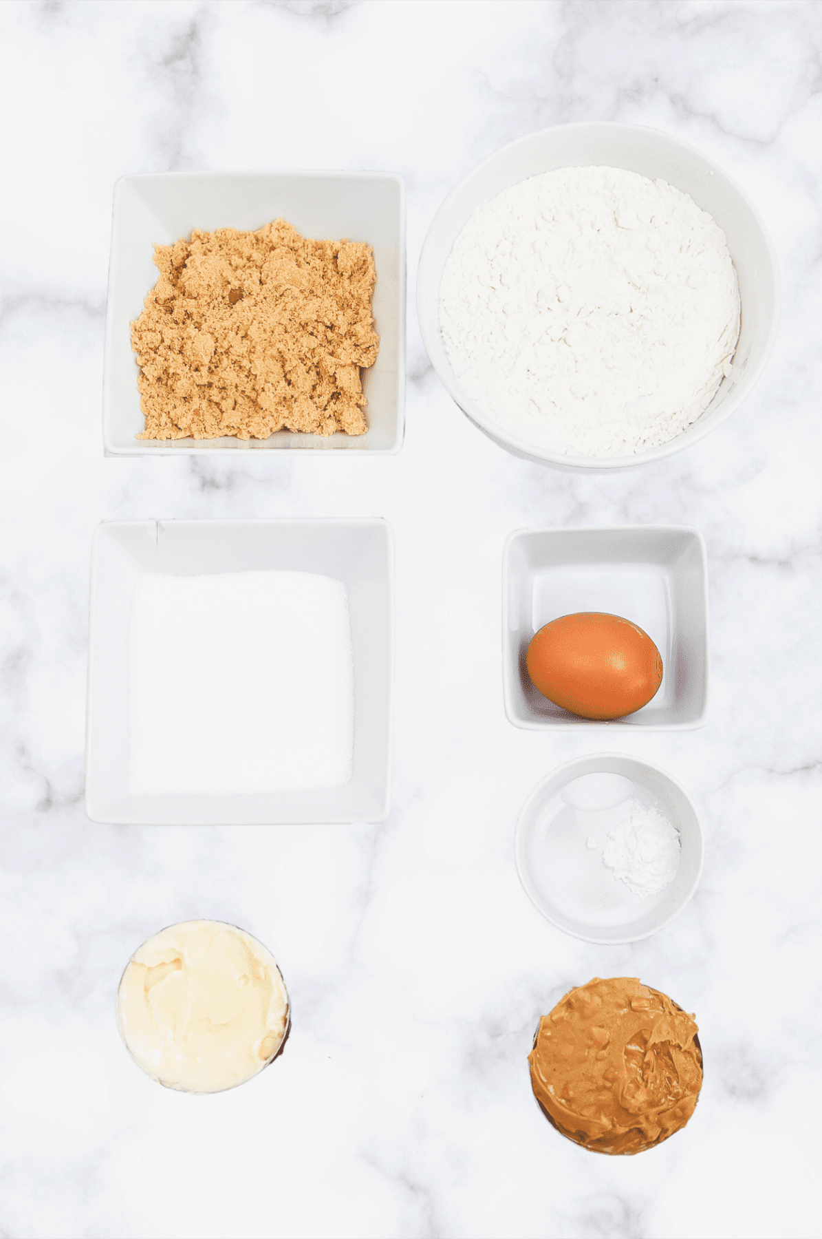 ingredients for air fryer peanut butter cookies in small containers.