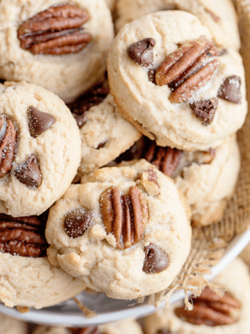 pecan chocolate chip cookies on a white plate